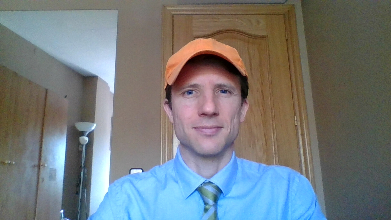 Teacher with an Orange Cap on